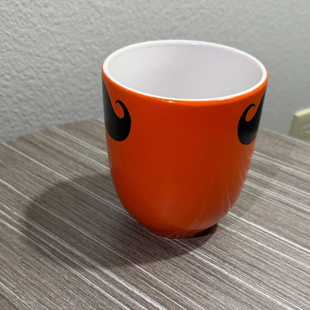 Orange Mug with Black Mustache Design